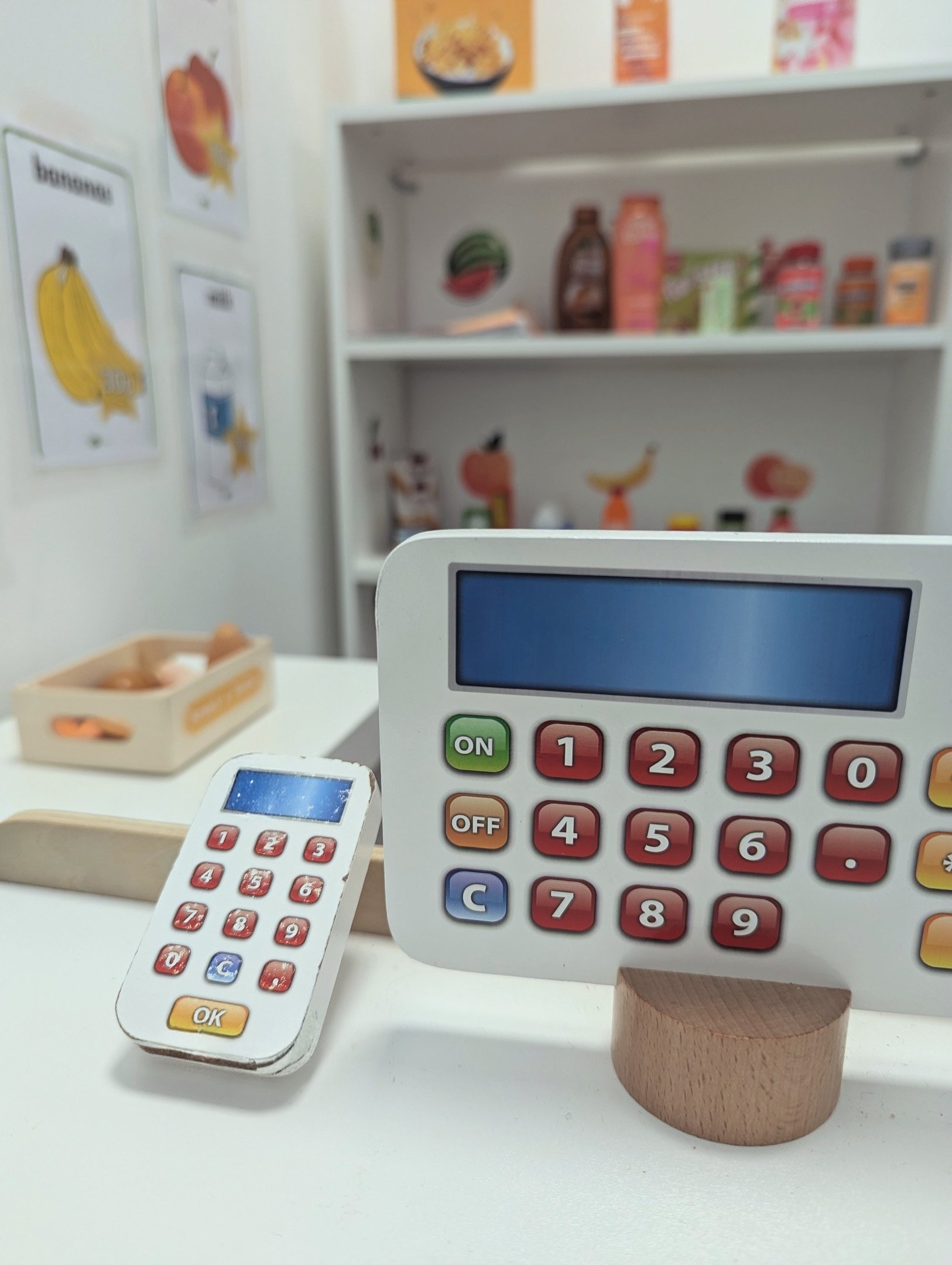 A wooden till and card machine in the role play shop