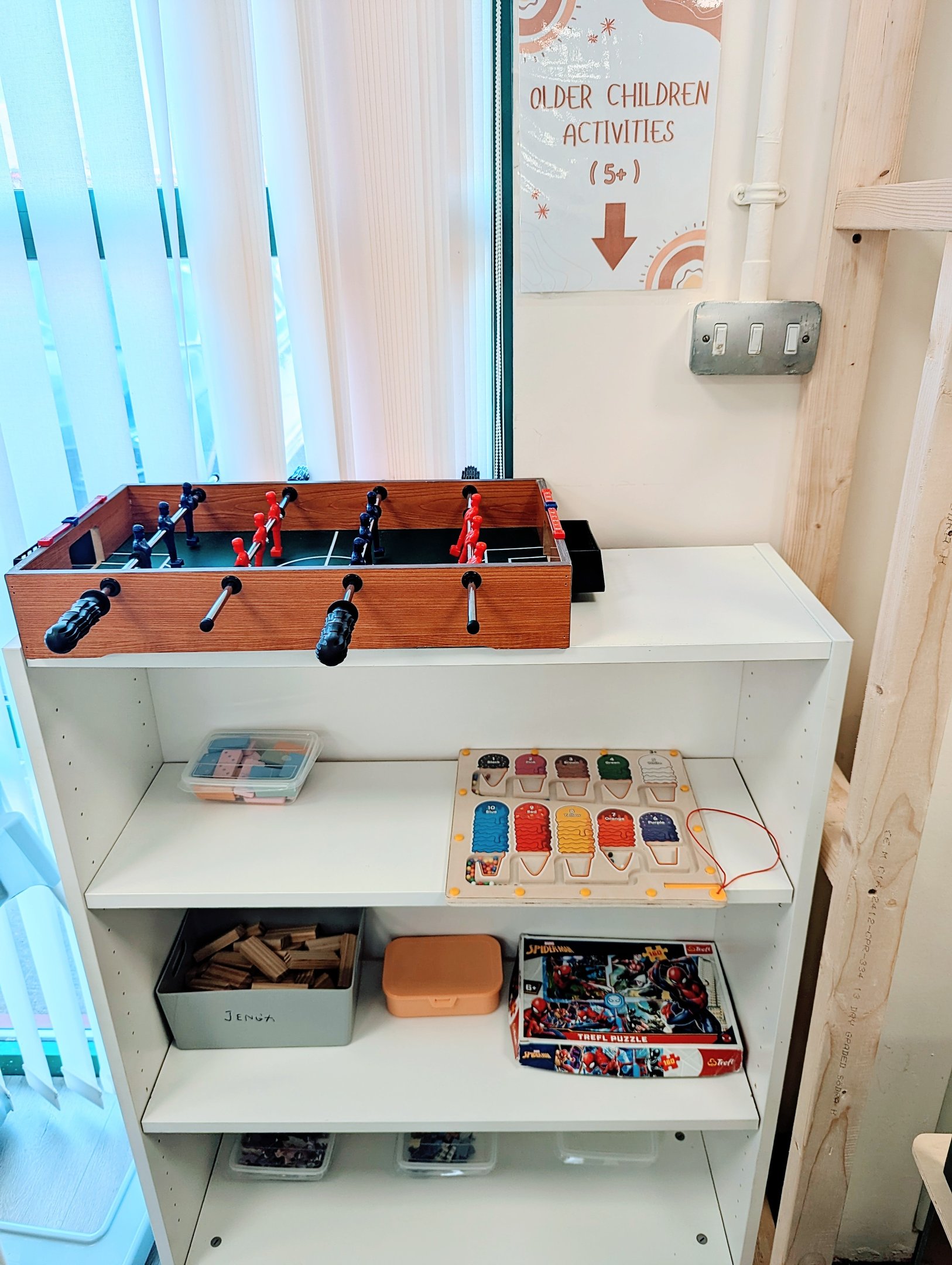 Shelves of games and puzzles for older children