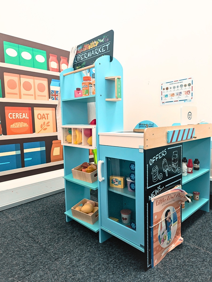 The role play supermarket stocked with wooden food