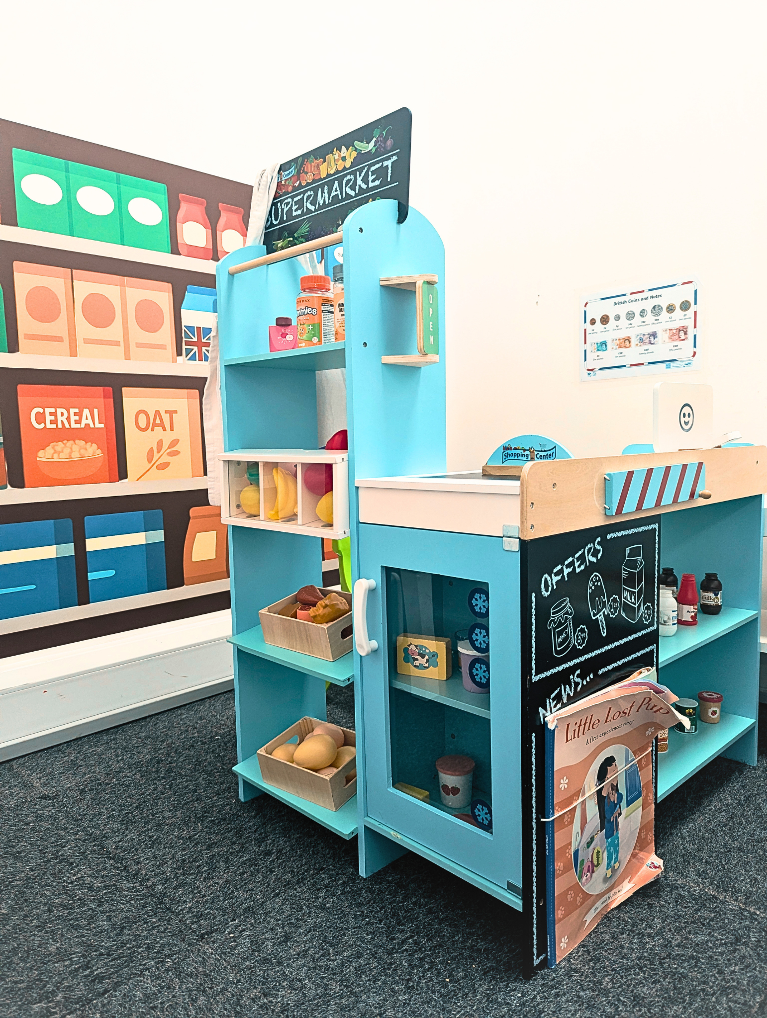 The role play supermarket stocked with wooden food