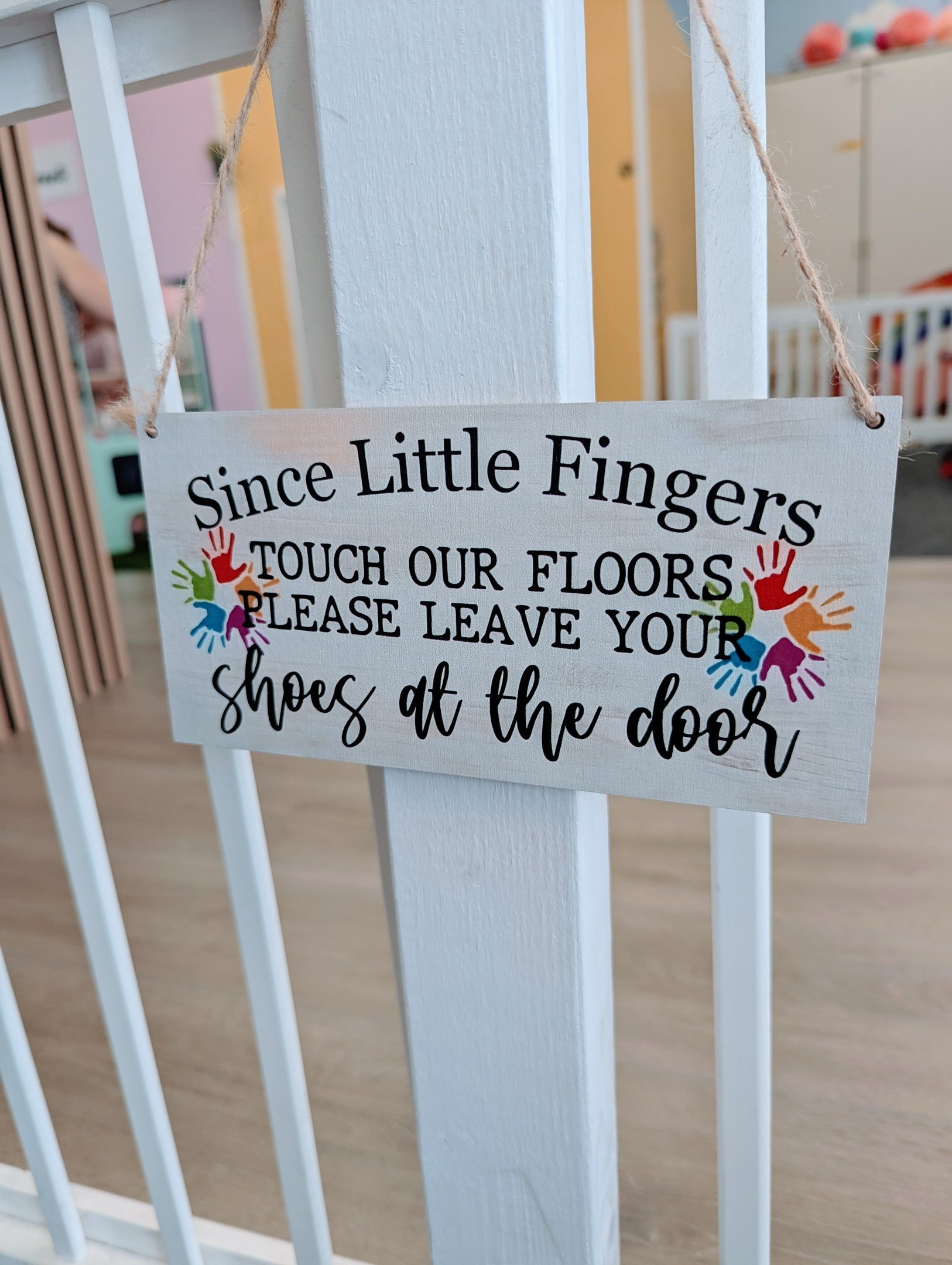 A sign asking visitors to leave their shoes at the door