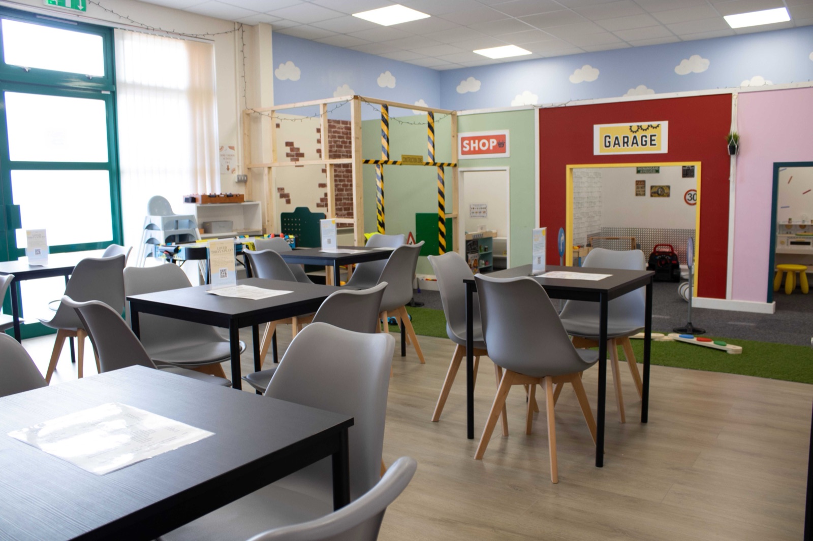 Play Lane's role play village with a garage, restaurant and vet clinic